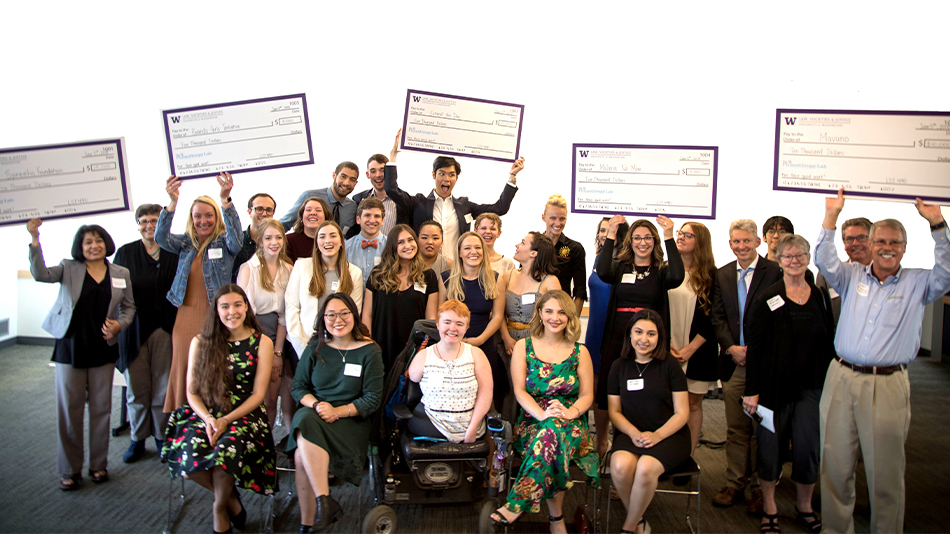 At a giving ceremony, Law, Societies & Justice students presented checks to nonprofits selected by their “Social Justice Through Philanthopy” class. Photo by Colette Cosner