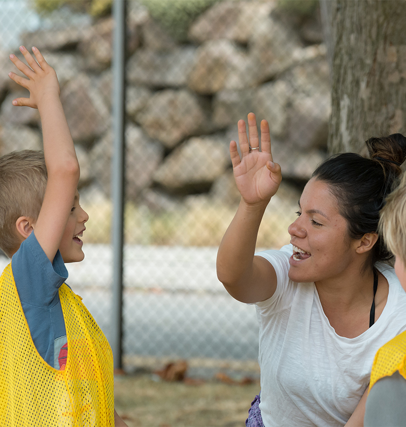 Student working with children