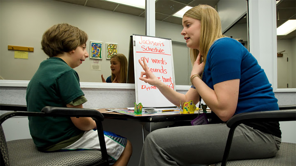 Student working with child