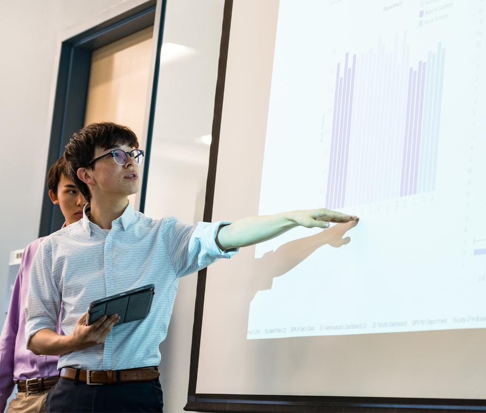 Student presenting research with screen projection