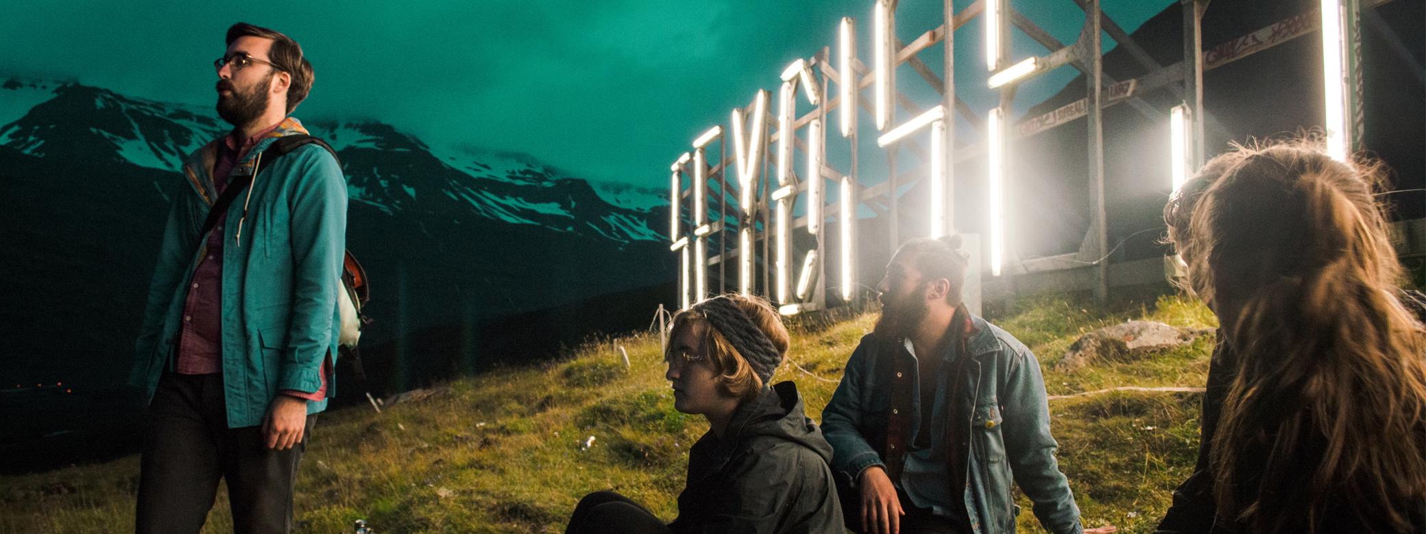 CHID students sitting on hill in Iceland during study abroad