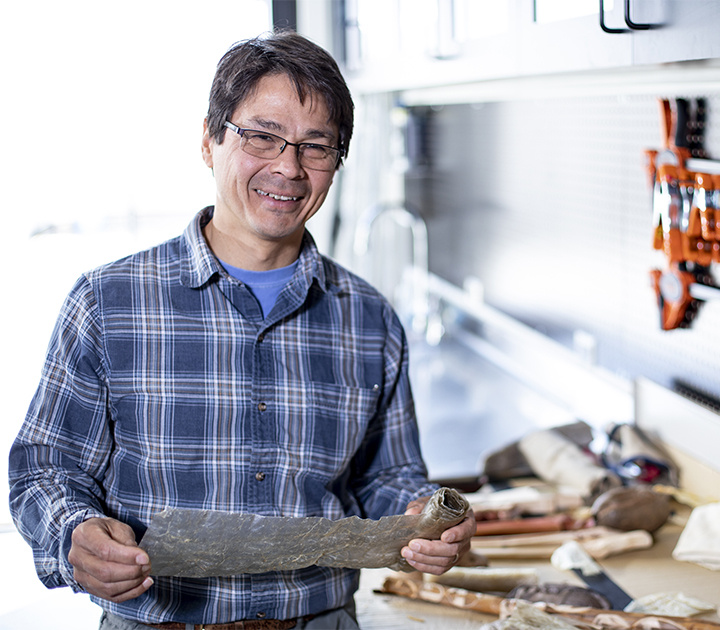 Sven Haakanson (AIS Adjunct faculty) working at the Burke museum