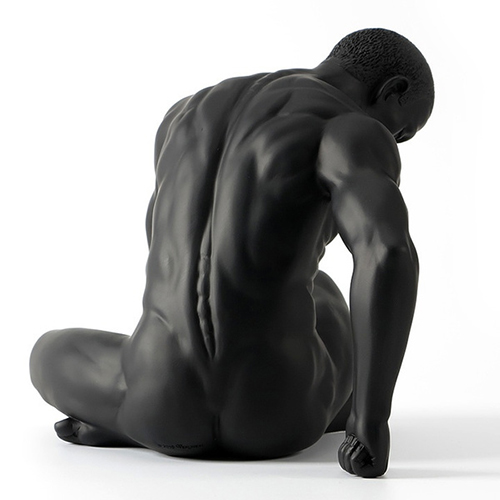 Sculpture of a muscular man, shown from the back