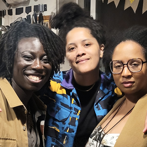 Nikki Yeboah, Kemi Adeyemi, and Jasmine Mahmoud together in a kitchen.