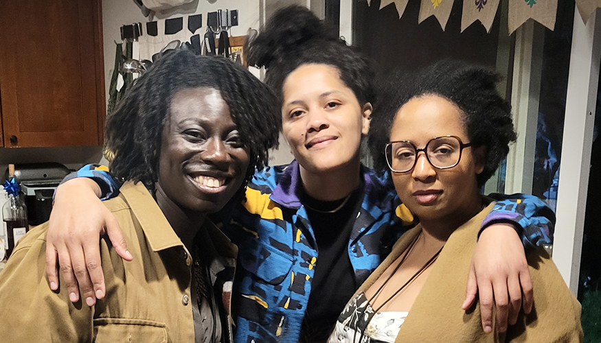 Nikki Yeboah, Kemi Adeyemi, and Jasmine Mahmoud together in a kitchen.