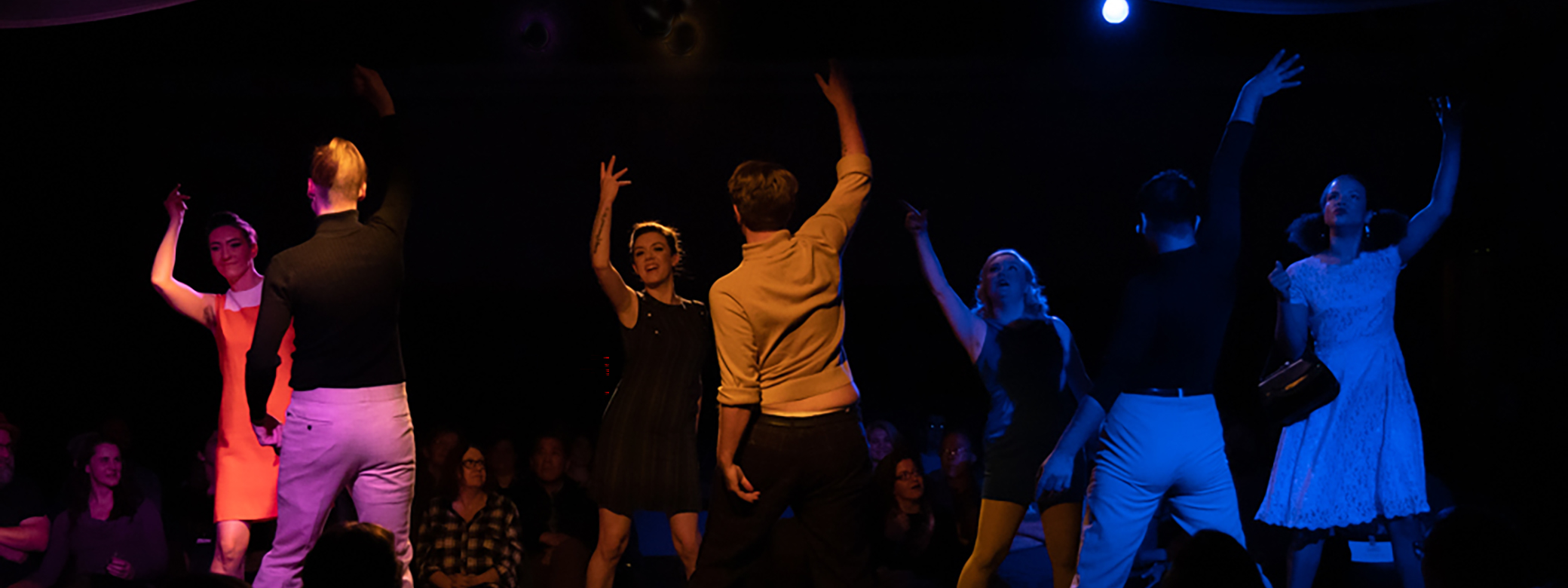 Noveltease Theatre performers dancing on stage