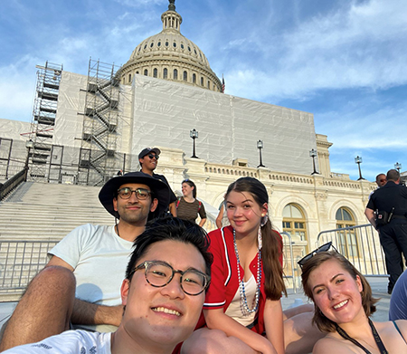 Lillian Williamson and fellow DC interns sitting on the steps of the US Capitol.