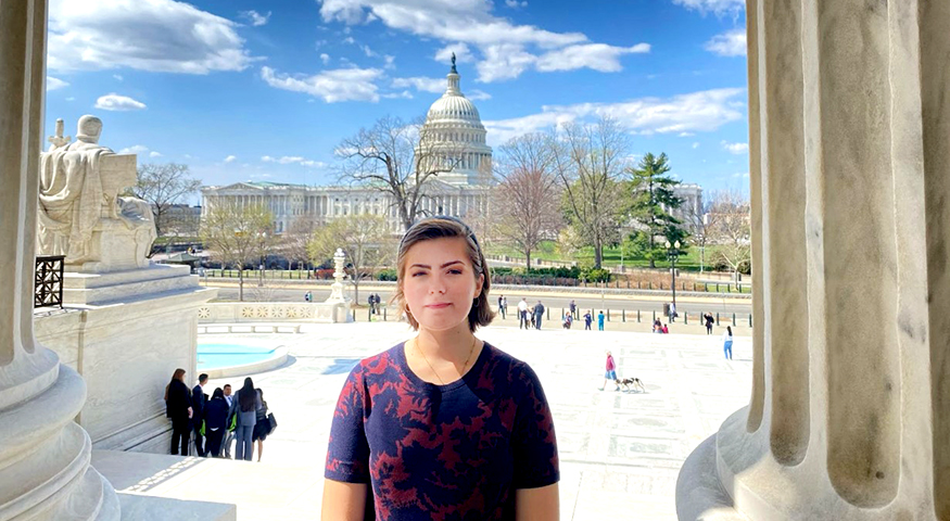 Lillian Williamson in Washington, DC, with the Capitol Building visible in the distance.