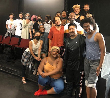 A group of dancers of all ages, attending a community class with Ron Brown and Arcell Cabuag.