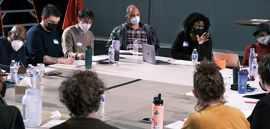 Nikki Yeboah and the actors read the script at a large table