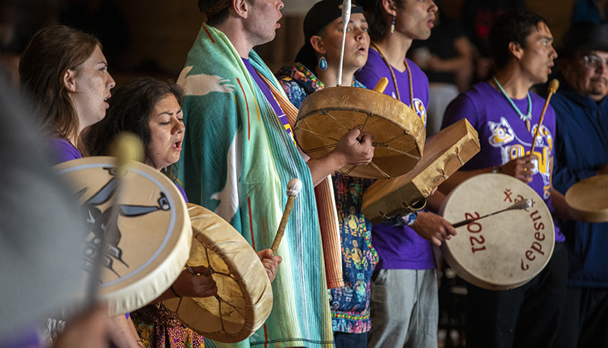 The UW canoe family singing at the canoe gifting ceremony during Tribal Canoe Journey