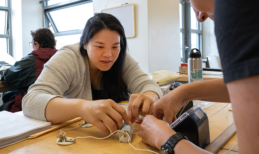 High school teachers conducting a physics experiment at the UW. 