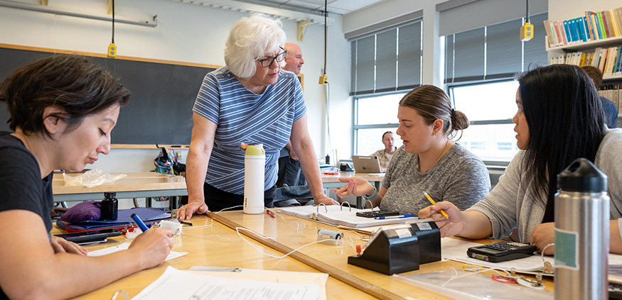 Donna Messina talking with high school physics teachers