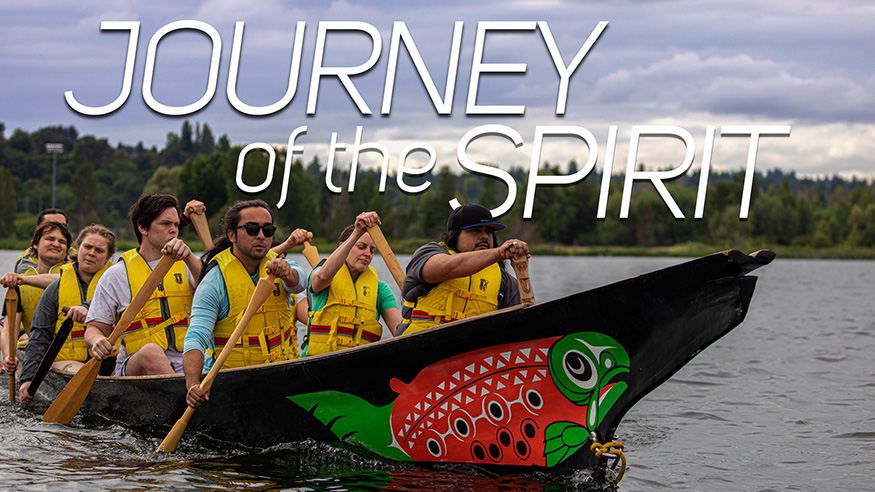 UW Canoe Family paddling in their colorful canoe