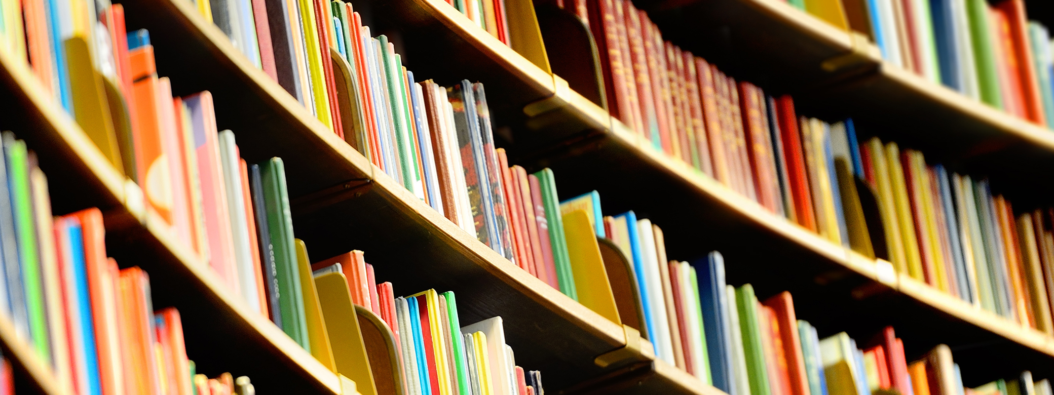 Curved shelves of colorful books