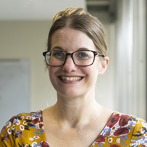 headshot of Adrienne Mackey