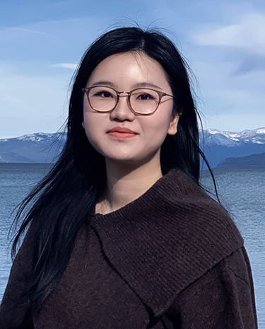 headshot of Yingtong Chen with blue sky and water in the background