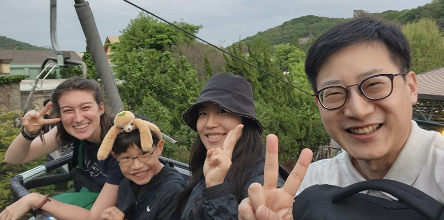 Katie Ruesink posing for a photo with her "adopted" Korean family.